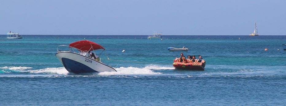 Speedboat pulling a towable