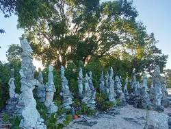 The sun rises behind the stones