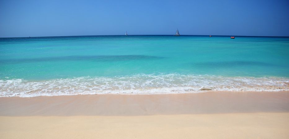 Tropical beach with soft sand and turquoise seas