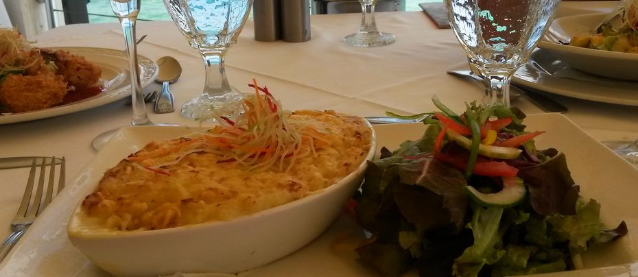 Table with fish pie and salad