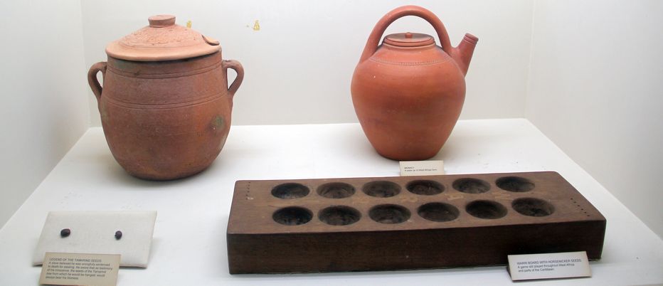 Pottery and a Warri board - symbols of African-Barbadian connections; displayed in the Barbados Museum