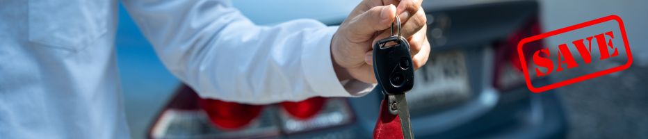Car rental employee handing over keys.
