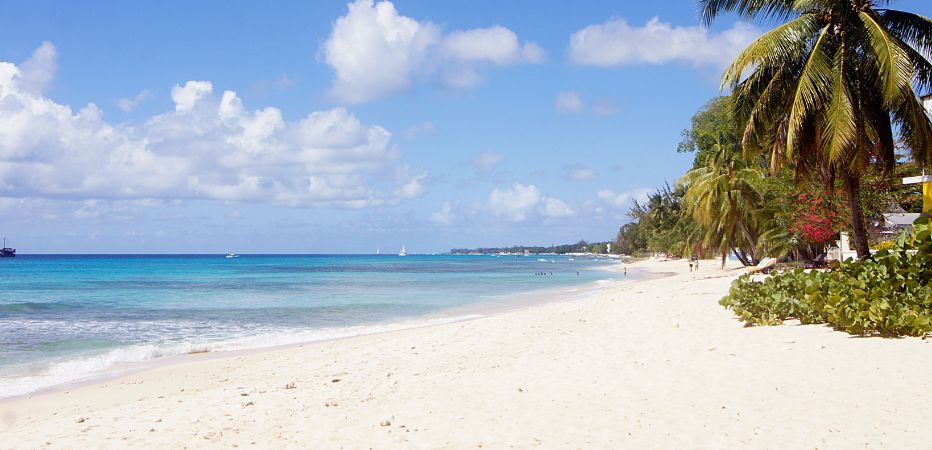 Looking north across the white sands and turquoise ocean waters at Fitts Village beach on Barbados' west coast