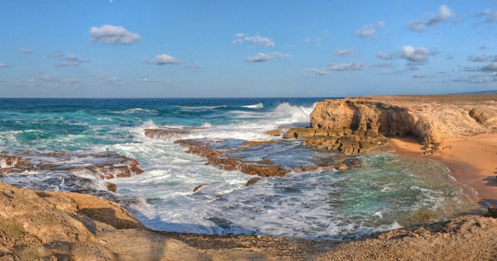 Panoramic view of the cliffs and waves of Little Bay, Barbados