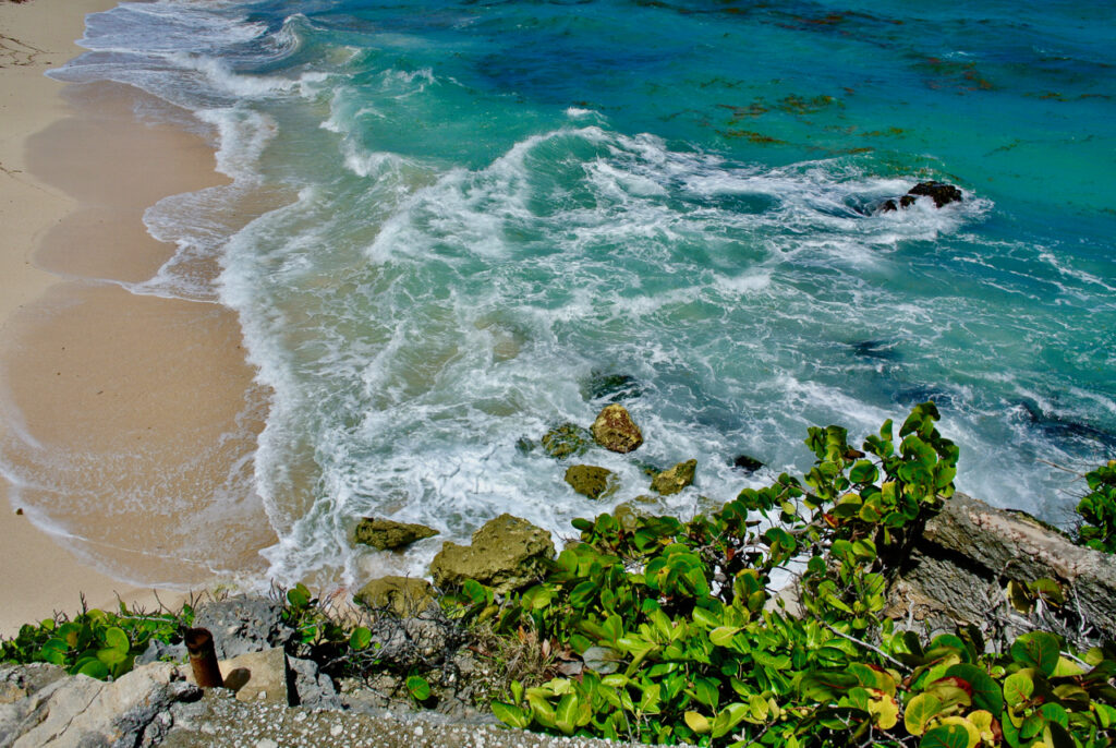 aocean facing the beach with the reefs at sea