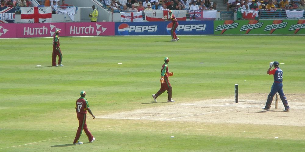 West Indies and England cricketers on the field during a cricket match at Kensington Oval.