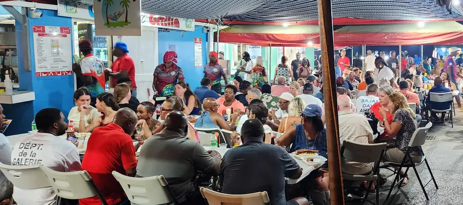 Large group of people enjoying Friday evening at Oistins Fish Fry