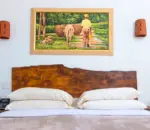 Rustic room at OceanBlue with culturally-inspired painting