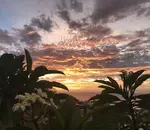 Colourful tropical sunset as seen from Sunset Point Apartment