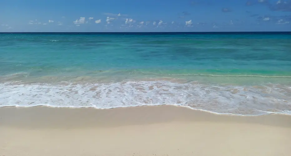 Rainbow Beach with its soft golden sands and turquoise waters