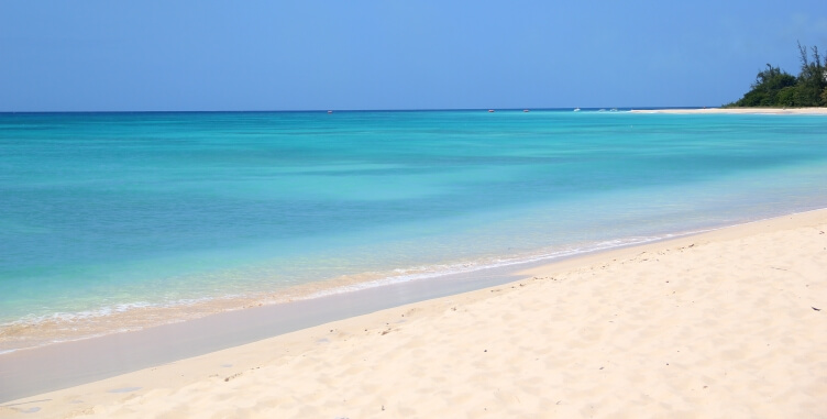 Soft white sands and turquoise waters at Brandons Beach