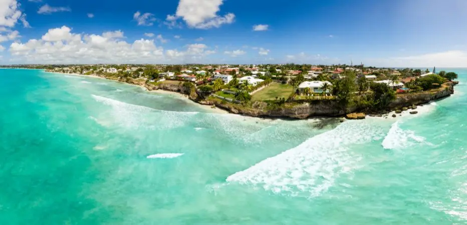 Panoramic view of the turquoise waters and waves at Freights Bay, taken by a drone