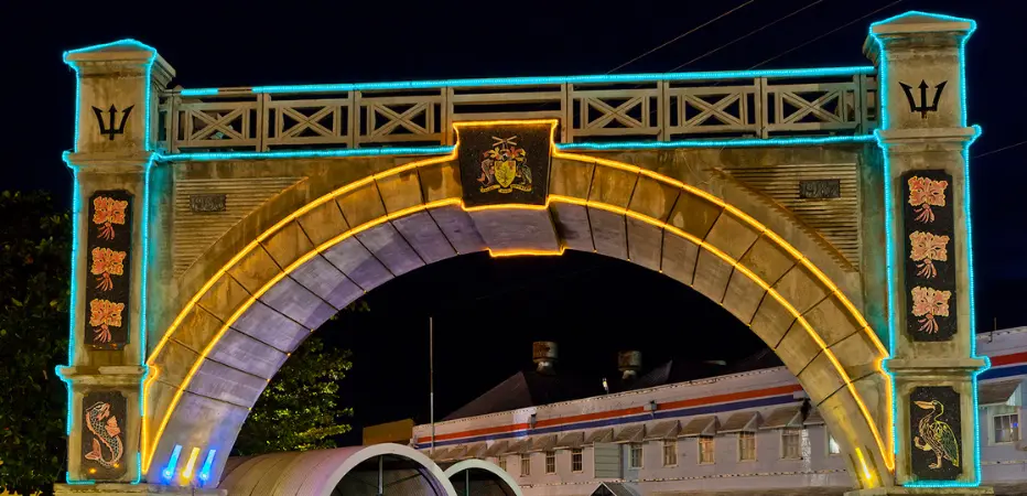 Independence Arch lit in blue and gold at night