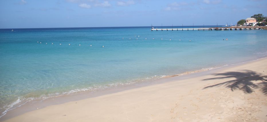 Tranquil clear waters lap onto sandy shores