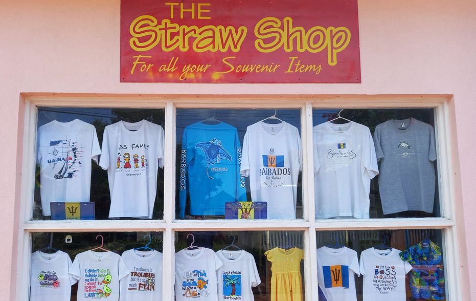 The Straw Shop window with a selection of tropical T-shirts