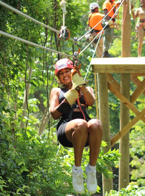 Woman smiling as she ziplines in Barbados