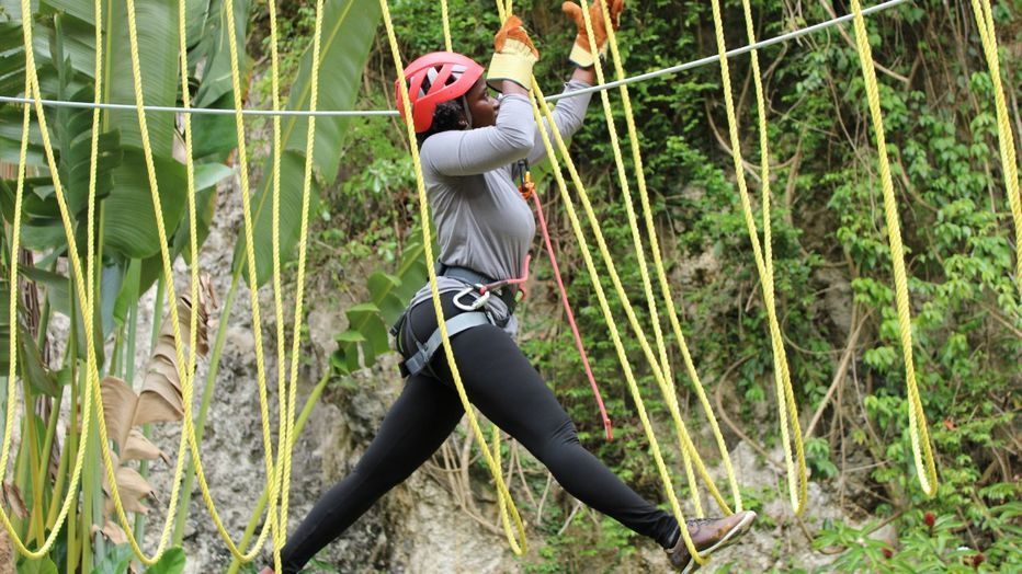 Lady traversing one of the obstacles